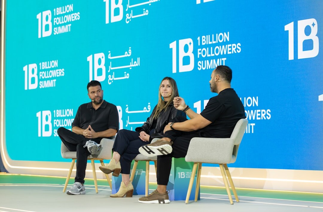 Panel discussion with speakers at a table on stage