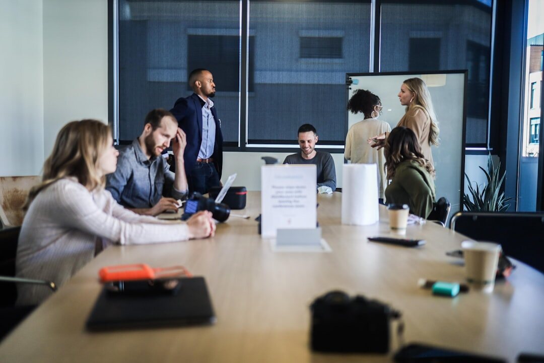Business professionals in a meeting room discussion
