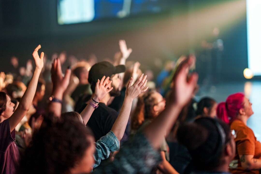 Large audience at a conference applauding