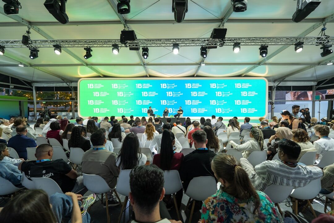 Corporate conference event with presenter and screen
